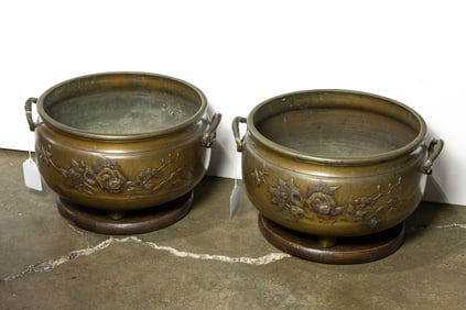 A pair of Japanese bronze jardineres