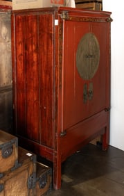 A Chinese red-painted cabinet