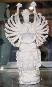 A Chinese Dehua figure of the 1000 armed Guanyin