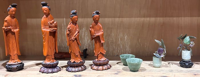 A shelf of Asian decorative articles