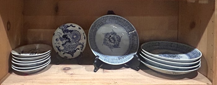 A shelf of Chinese export blue and white dishes
