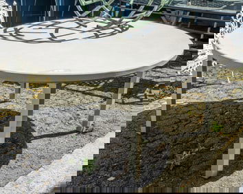 A large contemporary outdoor dining table