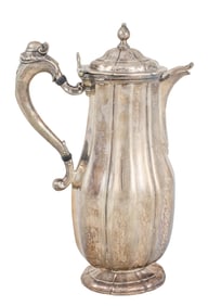 A Continental silver coffee pot, of fluted ovoid form, rising on a shaped foot, 10.5"h, 34.8 ozt