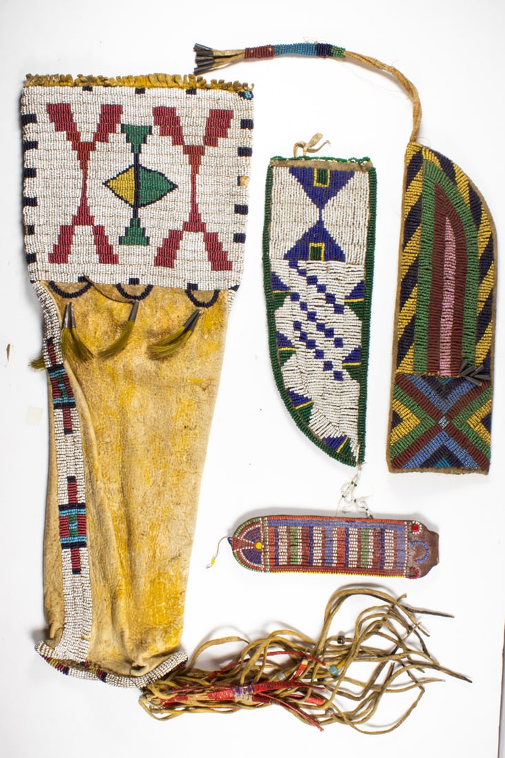 A lot of four Native American beaded items: A lot of four Native American beaded items, including a pipe case and two knife sheaths, the largest 18"l x 7"l