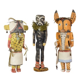 Three Hopi kachinas, including a wolf, a Kokole and a Bean Dance kachina