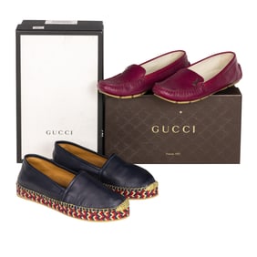 Two pairs of Gucci women's shoes in boxes