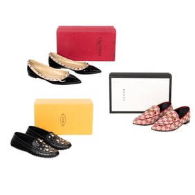 Three pairs of Gucci, Tod's and Valentino women's shoes in boxes