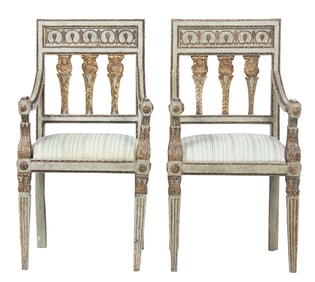 A pair of Neoclassical painted and parcel gilt armchairs