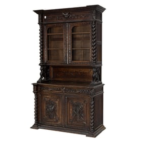 An Italian Baroque style oak hunt cupboard