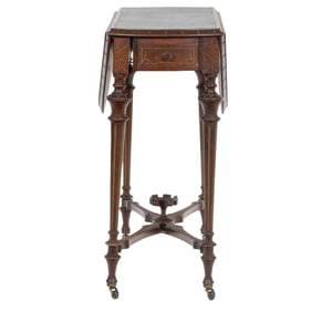 A Victorian Renaissance Revival drop leaf games table