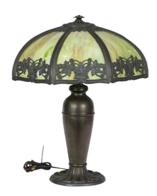 An Arts & Crafts slag glass and patinated metal table lamp