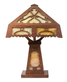 An Arts & Crafts caramel slag glass and oak table lamp