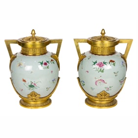 A pair of Neoclassical gilt bronze mounted Chinese porcelain covered urns