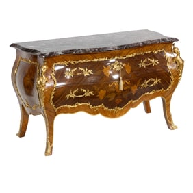 A French Louis XV style marquetry decorated commode