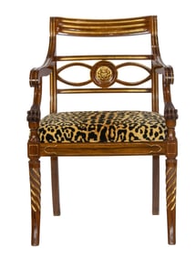 A Regency style parcel gilt armchair