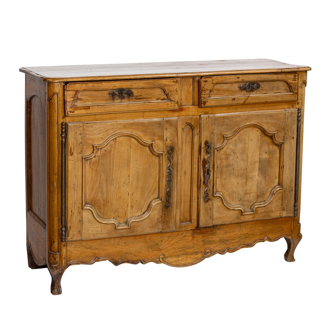 A Louis XV fruitwood sideboard: A Louis XV fruitwood sideboard, the outset rectangular top over twin side by side drawers drawers and a pair paneled doors, over a curved apron, rising on cabriole legs, two keys, 40"h x 54.5"w x 19"d