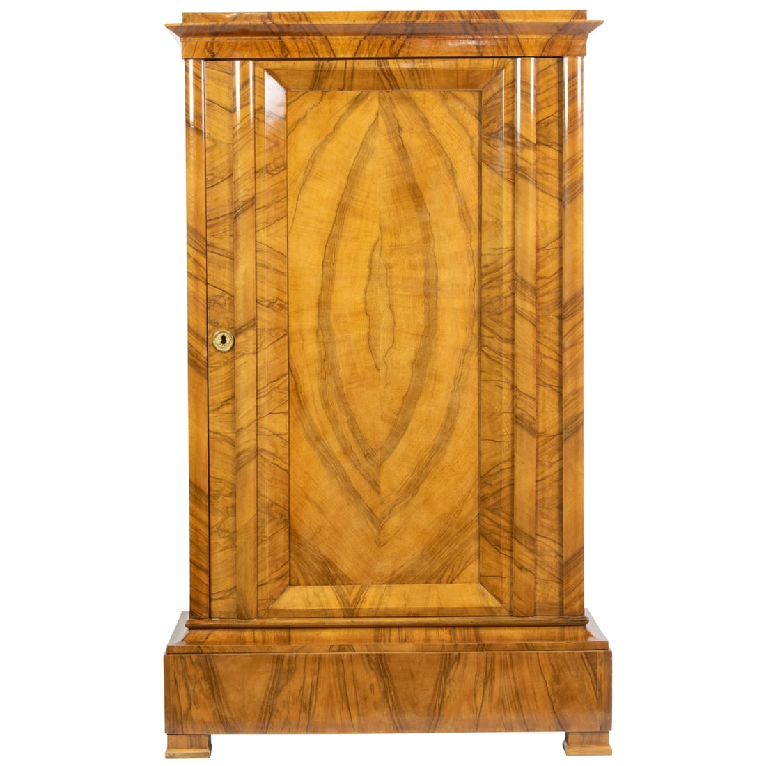 A Biedermeier fruitwood cabinet: A Biedermeier fruitwood cabinet, the single door opening to an arrangement of shelves, 64"h x 37.5"w x 18.5"d