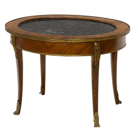 A French gilt bronze mounted walnut occassional table with marble inset top