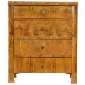A Biedermeier walnut commode