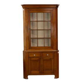 A Federal style cherry corner cabinet