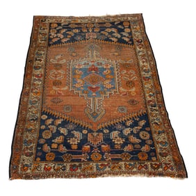 An antique Persian Heriz carpet