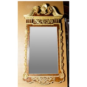 A George II parcel gilt and walnut veneer mirror