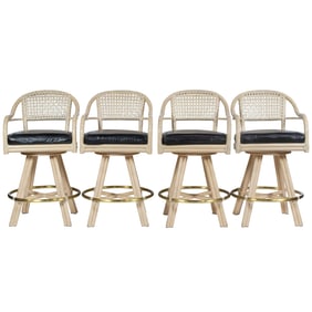A set of four McGuire rattan swivel barstools