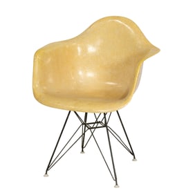 A Charles & Ray Eames molded fiberglass DAR arm chair