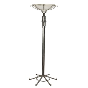 An Art Deco style iron and alabaster torchiere floor lamp in the manner of Paul Kiss
