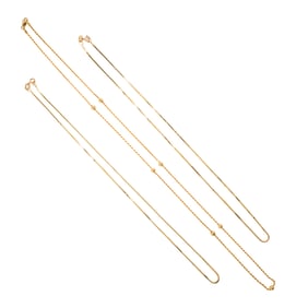 Three 18k gold chain necklaces