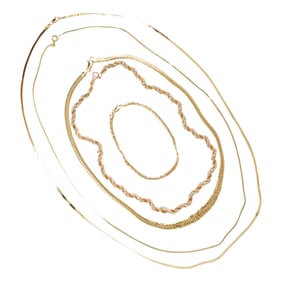 A group of gold chain jewelry