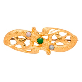 A gold and gem-set brooch