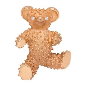 A 14k gold teddy bear brooch
