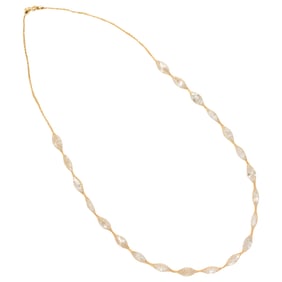 A cubic zirconia and 14k gold necklace