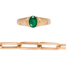 A 14k gold link bracelet and emerald ring