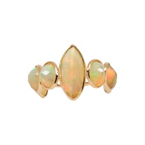 An opal and 18k gold ring