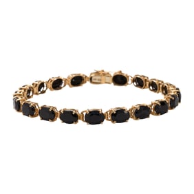 An onyx and 14k gold bracelet