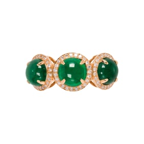 An emerald, diamond and 18k gold ring