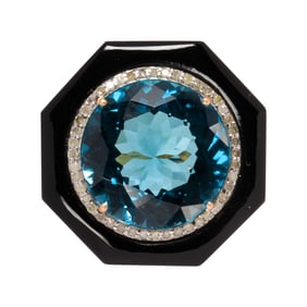 A blue topaz, diamond, onyx, silver and 14k gold ring