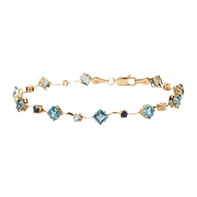 A gem-set and 14k gold bracelet