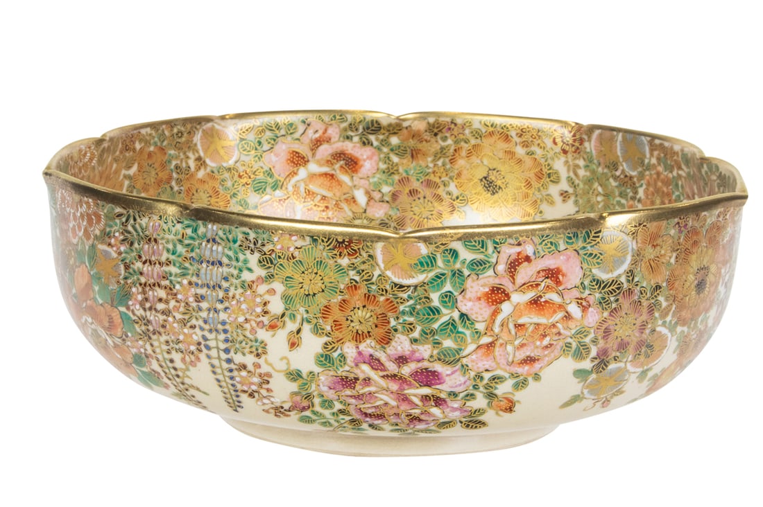 A Japanese Satsuma bowl: A Japanese Satsuma bowl. Featuring various floral motifs, Meiji period, 9.25" across. Provenance: Estate of Lila Mae Schneider Azad, Modesto, California.