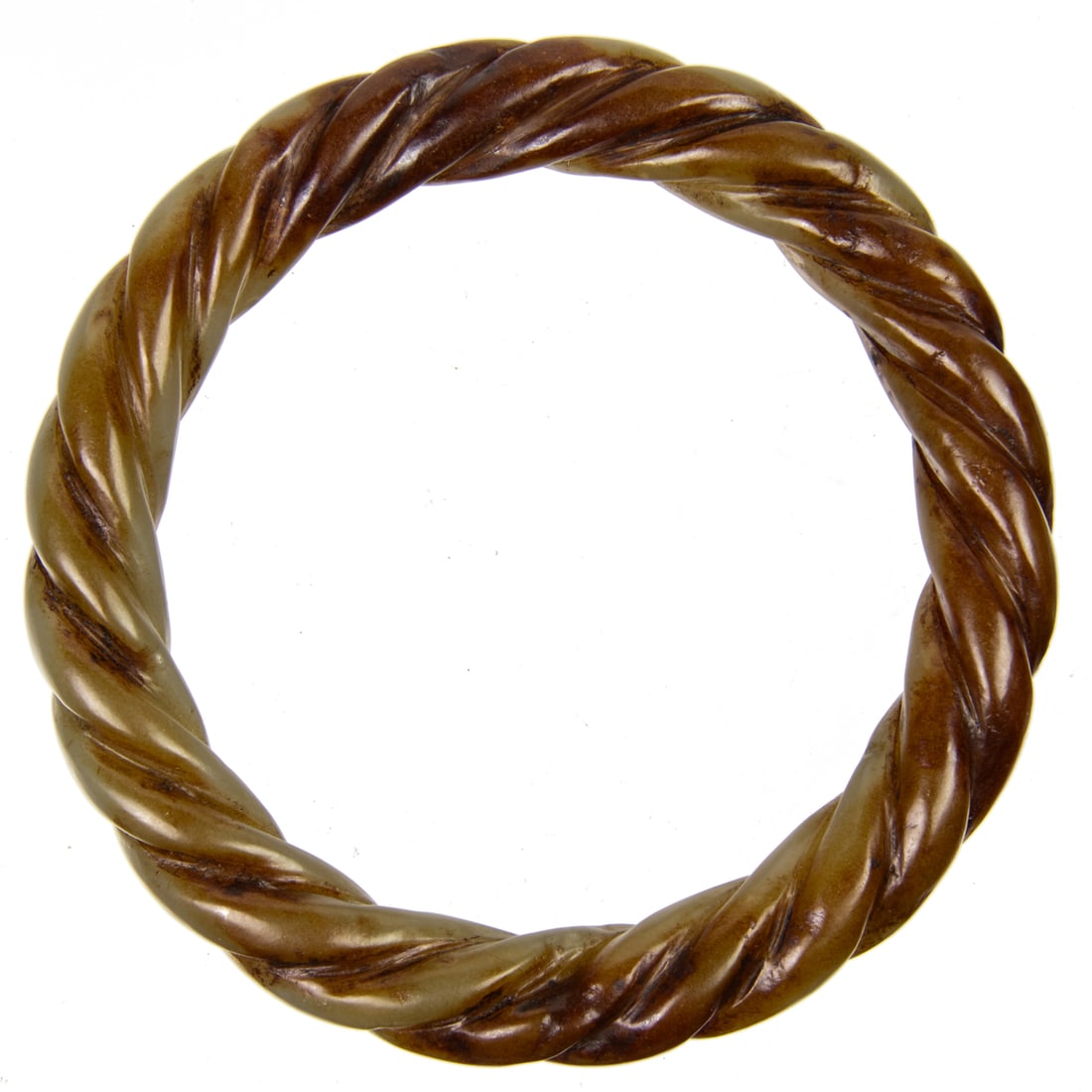 A Chinese celadon jade twisted rope bangle: A Chinese celadon jade twisted rope bangle. 3.25" across.