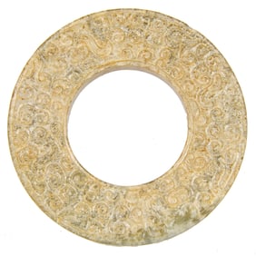 A Chinese chicken-bone jade ring