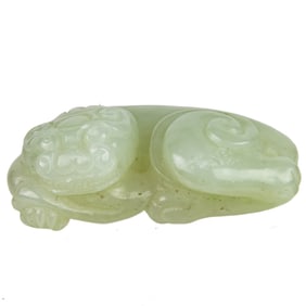 A Chinese celadon jade beast