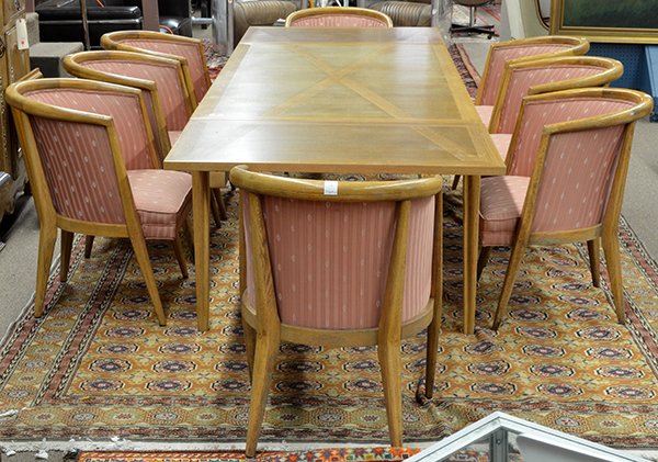 Romweber Mid Century inlaid dining suite: (lot of 9) Mid Century dining suite executed by Romweber, the oak draw leaf table with geometric marquetry above a continuous shaped apron rising on contoured legs, together with eight barrel back arm