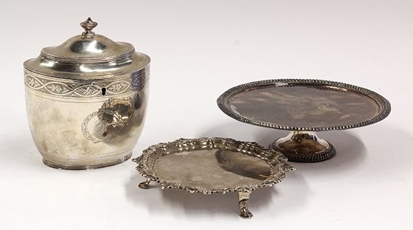 Early 19th century British sterling silver: (lot of 3) British sterling silver table accessories consisting of a George III tea caddy, by I.B., London, 1803/1804, decorated with a script B monogram surrounded by a laurel wreath, 7"; a biscuit s