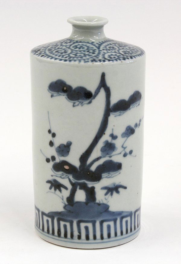 Japanese Porcelain Sake Bottle, Edo Period: Japanese blue-and-white sake porcelain bottle, Edo period, with a short neck above the cylindrical body, decorated with bamboo, pines, and plum blossoms, 6"h