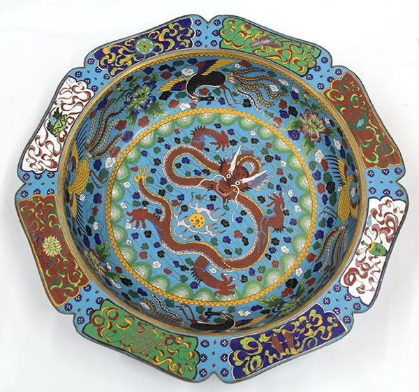 Chinese Cloisonne Enameled Basin: Chinese large cloisonne enameled basin, with an everted foliate edge featuring the eight auspicious Buddhist symbols in reserve, the well with a meandering red dragon in the center with phoenix and pe