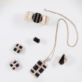 A group of onyx and silver jewelry