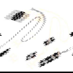 A group of onyx and silver jewelry: A group of onyx and silver jewelrycomprising a necklace, cuff, 2 rings and a pair of earclips; 130.00 grams gross